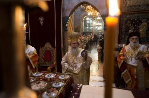 Greek Orthodox Patriarch of Jerusalem Metropolitan Theophilos (C) leads Easter service in the Church of the Holy Sepulchre in Jerusalem's Old City May 5, 2013. REUTERS/Ronen Zvulun