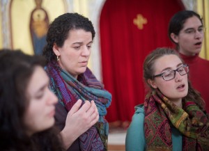 Christina Stavros, who participated in a pilot version of the Byzantine Music program this year at Holy Cross, helps lead the HCHC Women's Byzantine Choir during a recent recording session.