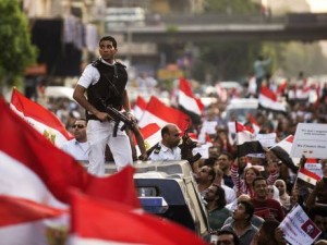 Policemen amid protesters demonstrating against the deposed President Mohammed Morsi AFP\Getty