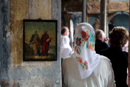 A worshipper attends a service in the Hagia Elia Church, which opened its door after 41 years in a bid to save it from developers. The Russian Orthodox church was erected on the top of a five-story building in Istanbul’s downtown port district of Karaköy. (Photo: Matilda Pinon)