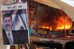 A protest camp is torched in Cairo's al-Nahda Square, on August 14, 2013. Supporters of deposed Islamist president Mohamed Morsi have torched a church in Sohag in a reprisal attack after police dispersed demonstrations in Cairo, according to the MENA state news agency.