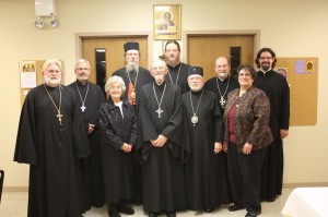 (back row from left) Archpriest Michael Senyo, Archpriest John Jillions, Bishop Melchisedek, Archpriest John Behr, Archpriest Chad Hatfield, Protodeacon Joseph Matusiak; (front row from left) Matushka Anne Hopko, Protopresbyter Thomas Hopko, Metropolitan Theodosius, and Dr. Stefanie Yazge.