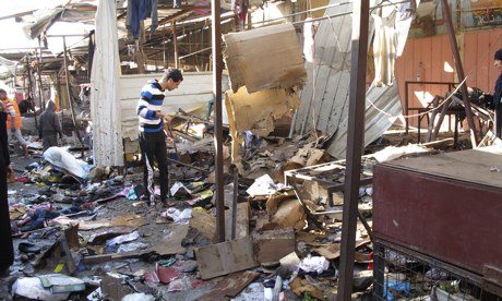 Debris at the site of the attack at the marketplace in Baghdad. Photograph: Reuters