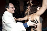 Bare-breasted Femen protesters besiege bishop in Spain