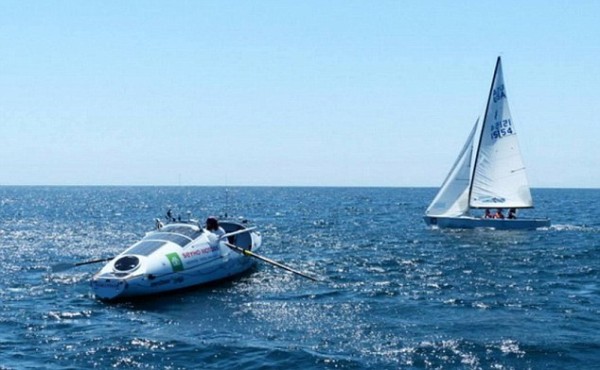 He arrived in the white, nine-metre carbon fibre ocean row boat with a smile on his face