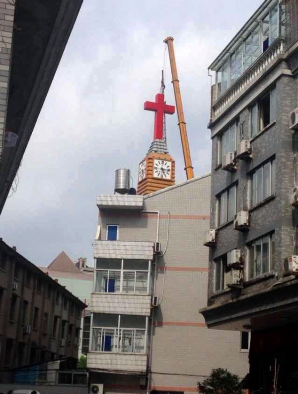 One of the two crosses that were removed on Friday from the Wenling Church in Taizhou in Zhejiang Province, China. Congregants said hundreds of Christians sang hymns as the riot police surrounded the church. Credit Lemon Huang