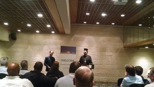 Father Gabriel Nadaf addresses a group of 51 Evangelical pastors from the U.S. on Tuesday. Photo: Sean Savage.