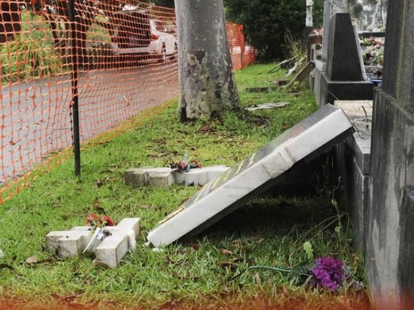 One of the toppled headstones. Picture: Phillip Rogers
