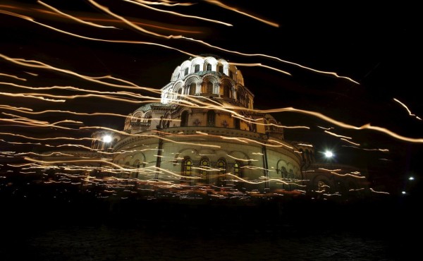 Worshippers walk with candles around the golden-domed Alexander Nevski cathedral during the Orthodox Easter service in Sofia. April 12, 2015.