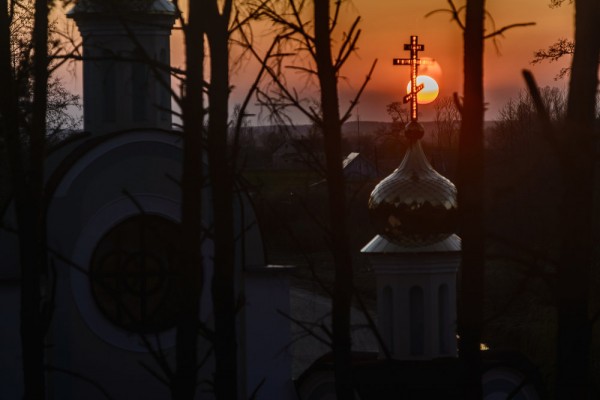 The Sun sets behind the St. Yelisei’s Lavrishevo monetary during Orthodox Easter at the village of Gnesichi in the Grodno region, about 150 km from Minsk, Belarus. April 11, 2015.