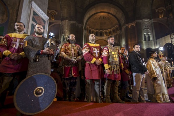 Men dressed as Serbian knights attend an Orthodox Easter service in the St. Sava temple in Belgrade. April 12, 2015.