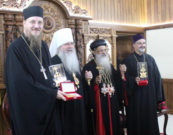 Catholicos Paulose presents commemorative gifts to Fr. Behr, Metropolitan Tikhon, and Fr. Voytovich. Photo: http://oca.org