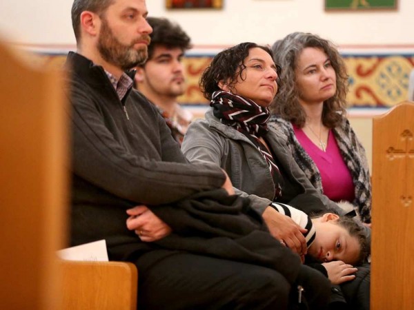 A young boy gets comfy on his mom’s lap as the service wears on. JULIE OLIVER / OTTAWA CITIZEN