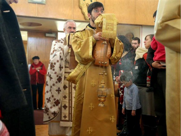 Deacon Michael La Libertie leads Father Maxym Lysack on a procession through the congregation during the service. Christ the Saviour Orthodox Church. JULIE OLIVER / OTTAWA CITIZEN