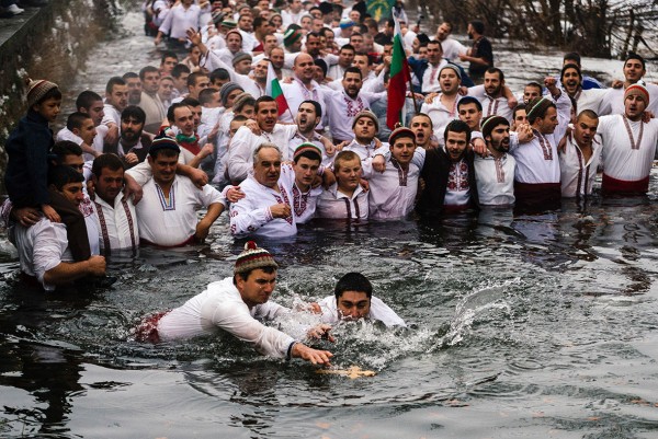 Two men scuffle to grab a wooden cross in the icy winter waters of the Tundzha river in the town of Kalofer, BulgariaDimitar Dilkoff/AFP