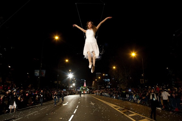 A performer dances as she hangs from a balloon during the Three Kings parade in Madrid Pablo Blazquez Dominguez/Getty Images