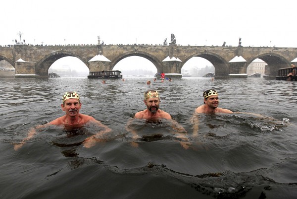 epiphany day People take part in the traditional Three Kings swim in the the Vltava River alongside the medieval Charles bridge in Prague, Czech Republic David W Cerny/Reuters