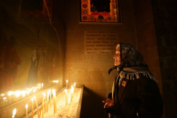 An Armenian Orthodox woman prays at the Saint Sarkis Church during Christmas celebrations in Damascus, Syria Louai Beshara/AFP