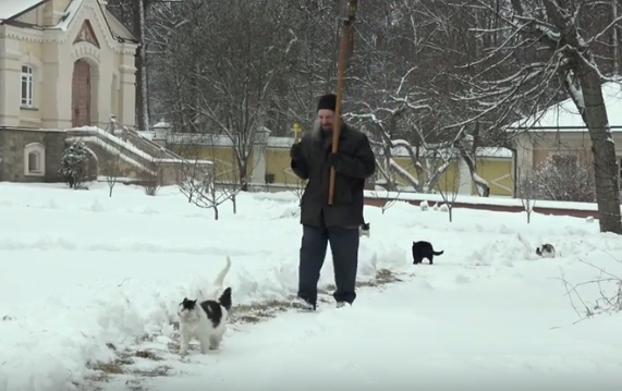 Cats procession with cross held in the Optina Pustyn