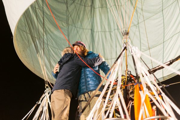 Russian adventurer Fedor Konyukhov hugs a member of his support staff before lift off (Oscar Konyukhov/ Reuters)