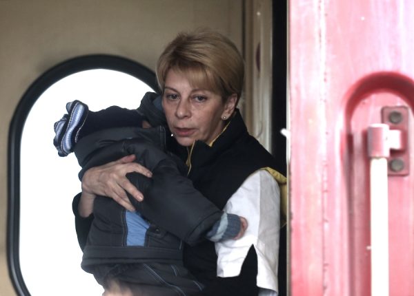 Doctor Liza would often carry Donbass children to safety herself. Photo: Moscow Times.
