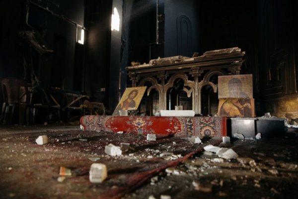 Iraqi Christians driven out by ISIS return to worship in desecrated Church
