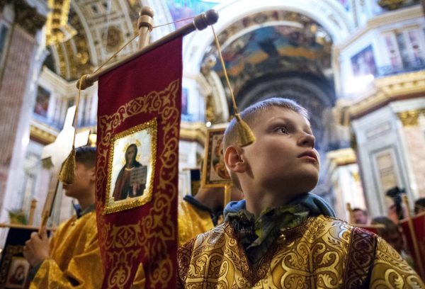 Photo: A boy during a Divine Liturgy for children at St. Isaac's Cathedral//Igor Russak. Ria Novosti