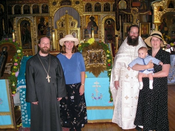 Fr. Gregory Joyce and his Matushka at Fr. Daniel's ordination. M. Anna holding little Yasha