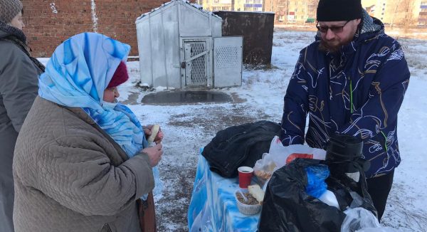 Priest Feeds the Homeless in Ishimbay