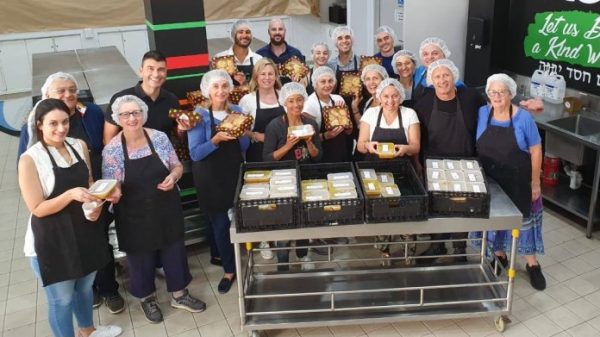 Volunteers from St George Greek Orthodox Church in Rose Bay gather to cook for the homeless