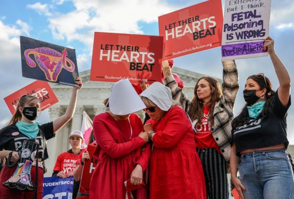 With prayers and signs, abortion demonstrators converge on U.S. Supreme Court